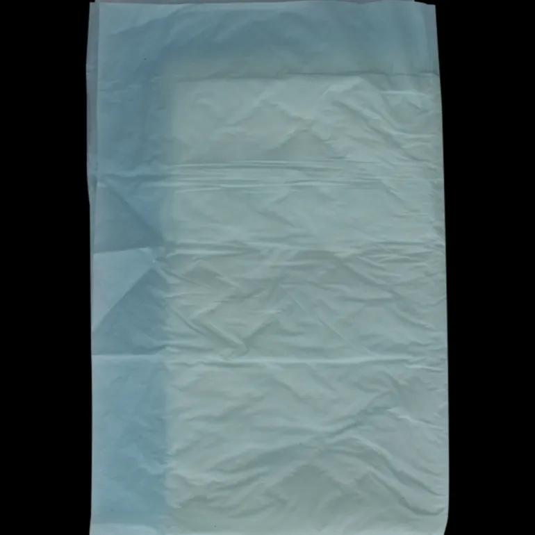 Blå underlag til seng og stol – engangsbeskyttelse ved inkontinens