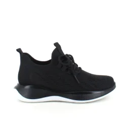 Sorte strikkede slip on sko med en fast kant i åbningen.