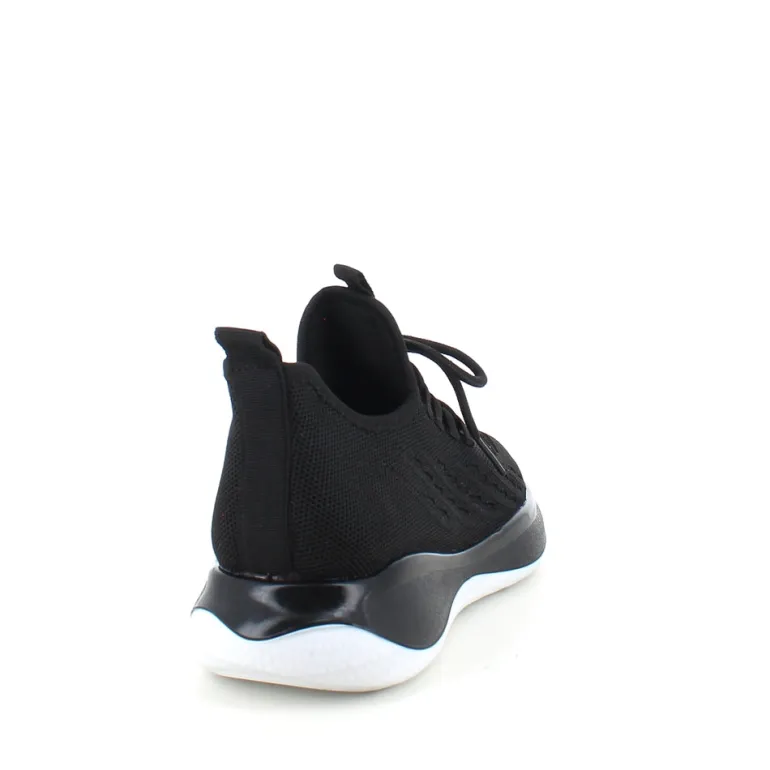 Sorte strikkede slip on sko med en fast kant i åbningen.